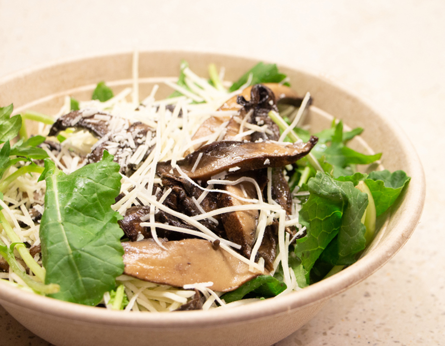 Bowl of salad with portobello mushrooms.