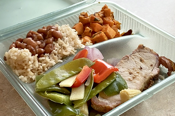 Pork, veggies, rice and beans, and sweet potato.
