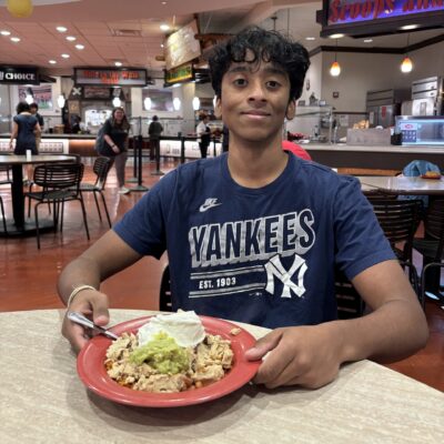 Aditya with a plate of food.