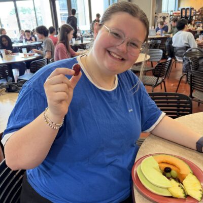 Emma with a plate of food.